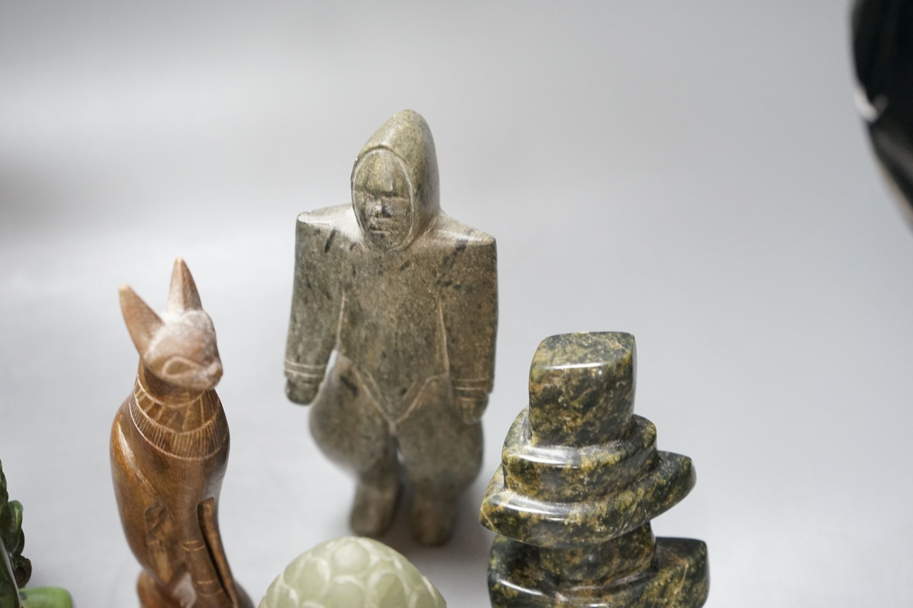 A group of Inuit and African stone carvings 19cm